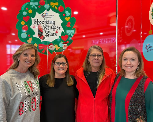 Illinois Mutual employees volunteering at the Stocking Stuffer Store