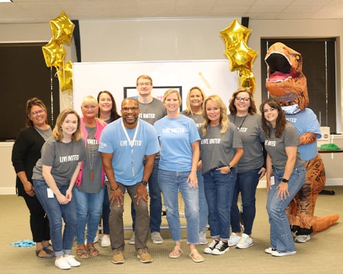 A group picture of the Illinois Mutual employees on the United Way Committee