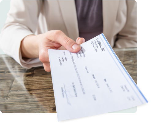 a woman extending her hand with a pay check