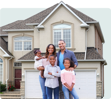 A family standing in front of their house