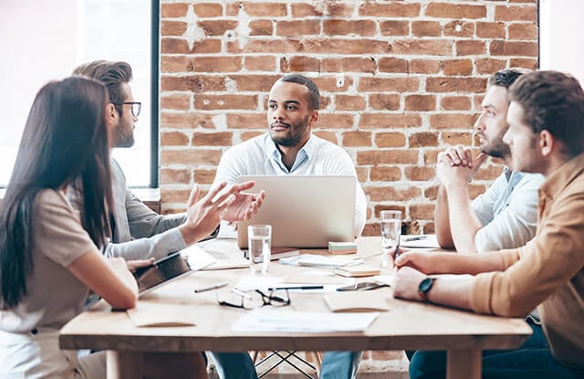 coworkers meeting around a table