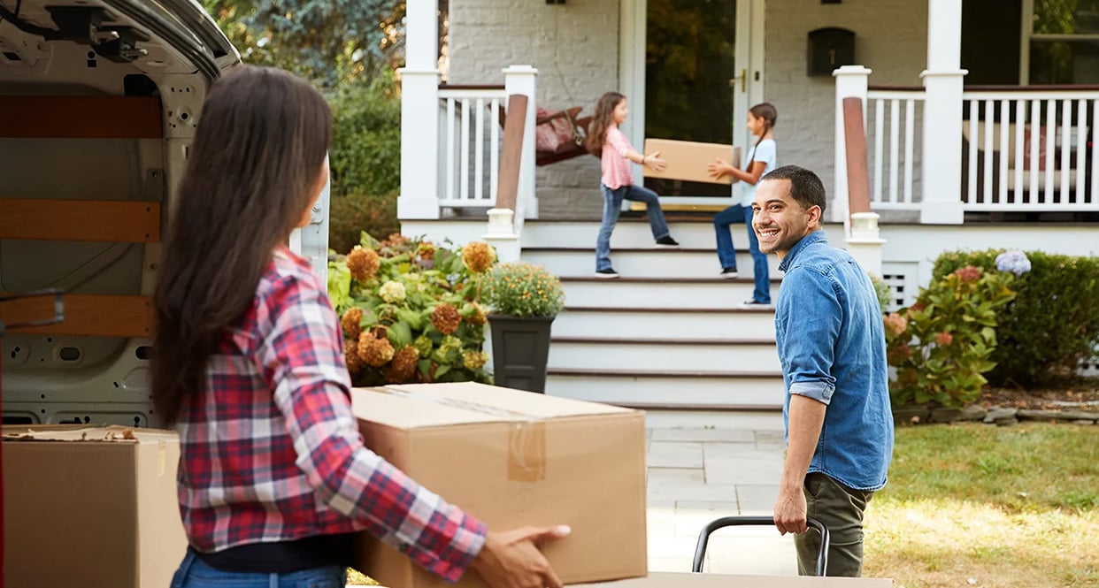 image of a young family moving into a new home