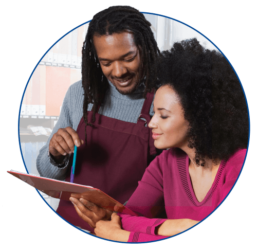 circular photo of two small business owners looking at clipboard