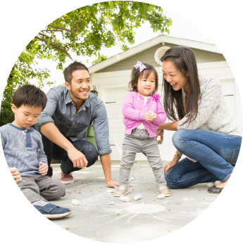 image of a family outside playing with the children